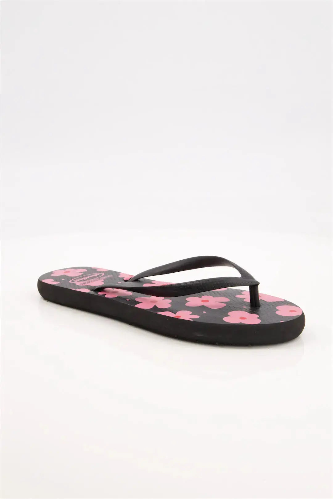 Street Feet's Flower Design Flip-Flops in black sole and pink flowers, featuring soft soles and durable rubber straps for maximum comfort. Lightweight and breathable, ideal for casual wear.