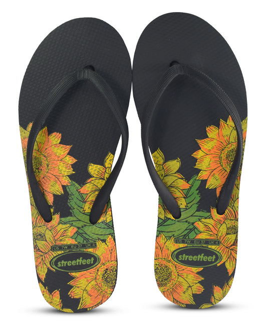 Bloom Flip-Flops featuring a yellow floral design, soft cushioned soles, and durable rubber straps for everyday comfort. Available in 4 variants- yellow, red, black and white.