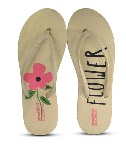 Flower Flip Flops by StreetFeet – An elegant and comfortable white footwear option with a delicate floral design, cushioned footbed, and a durable set of straps. A perfect addition to your wardrobe for a fresh and feminine look.