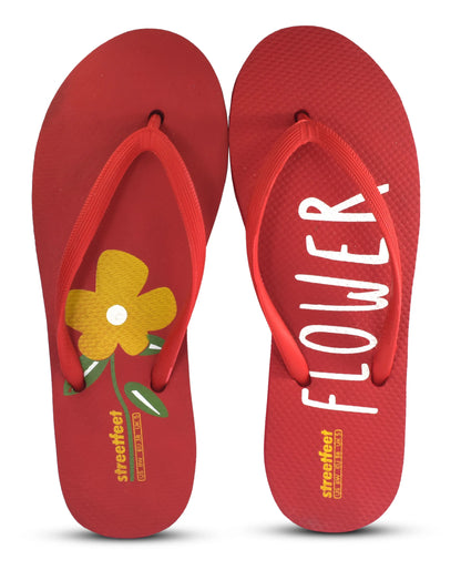 Flower Flip Flops by StreetFeet – An elegant and comfortable red footwear option with a delicate floral design, cushioned footbed, and a durable set of straps. A perfect addition to your wardrobe for a fresh and feminine look.