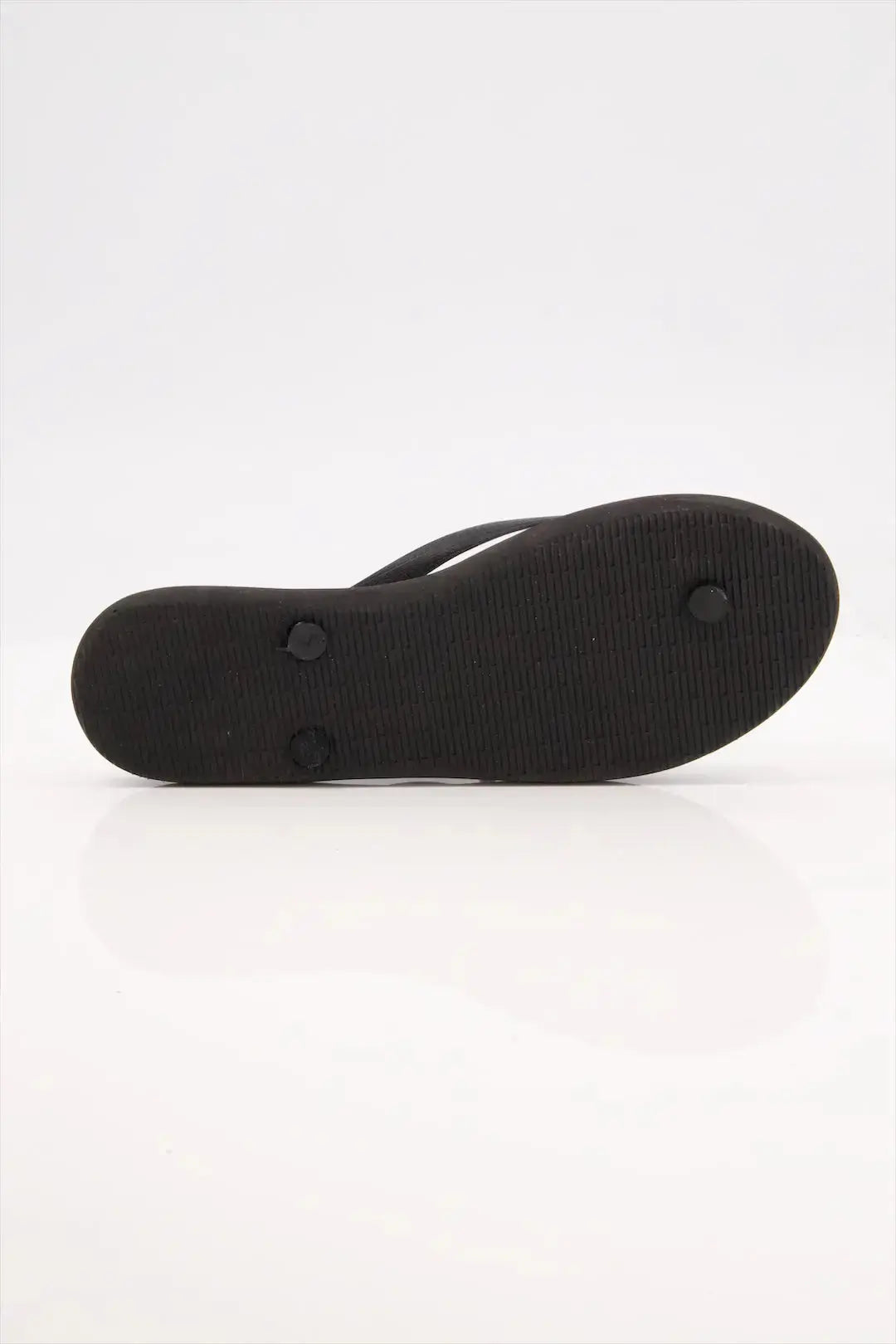 Street Feet's Flower Design Flip-Flops in black sole and white flowers, featuring soft soles and durable rubber straps for maximum comfort. Lightweight and breathable, ideal for casual wear.