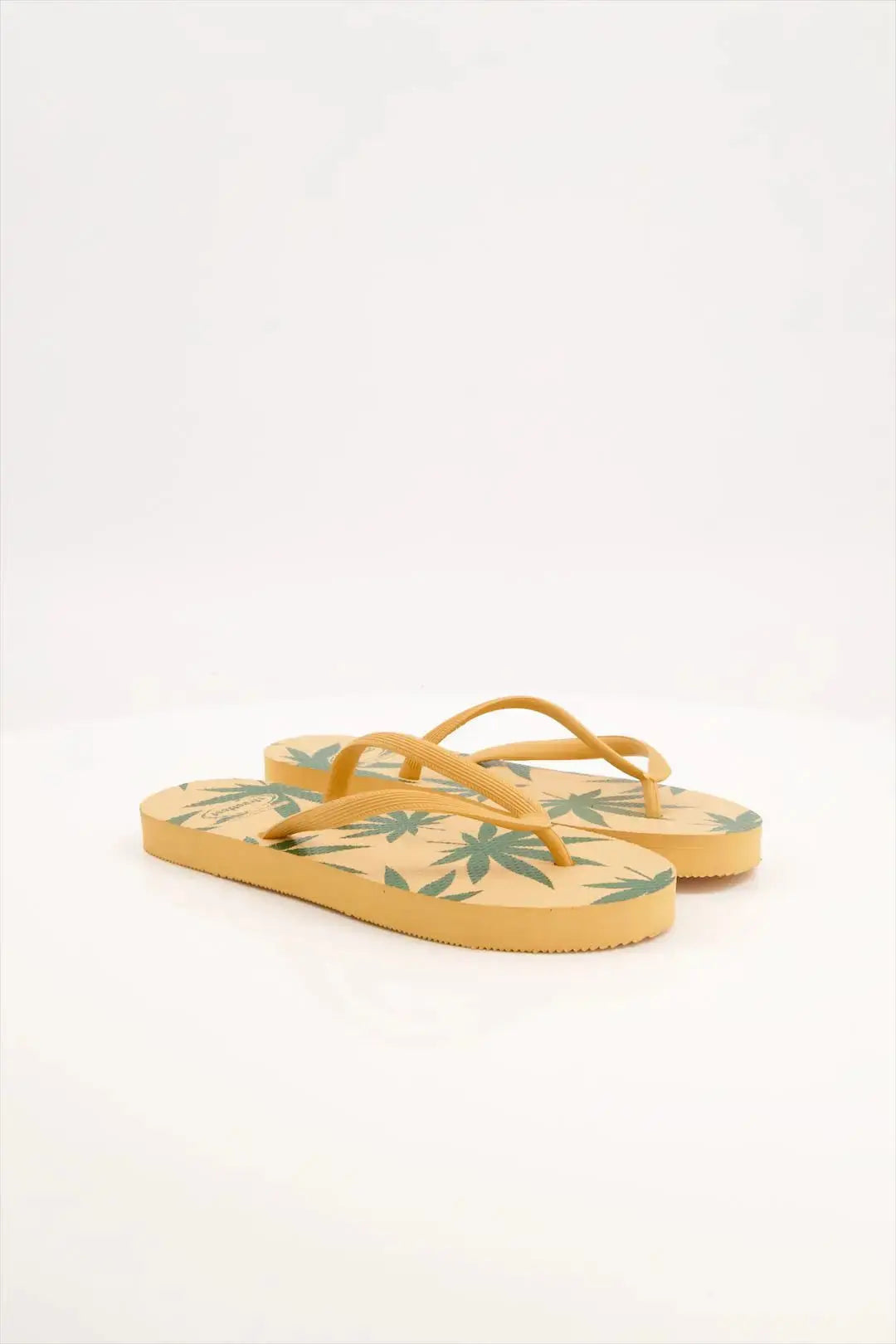 Leafy Pattern Flip-Flops with vibrant green leaf design, featuring soft cushioned soles and sturdy rubber straps.
Lightweight and breathable flip flops for casual everyday wear, perfect for summers.
Ideal ladies sandals for any occasion and activity. 
Available in 2 versatile color combinations-  yellow & black and green & off-white.