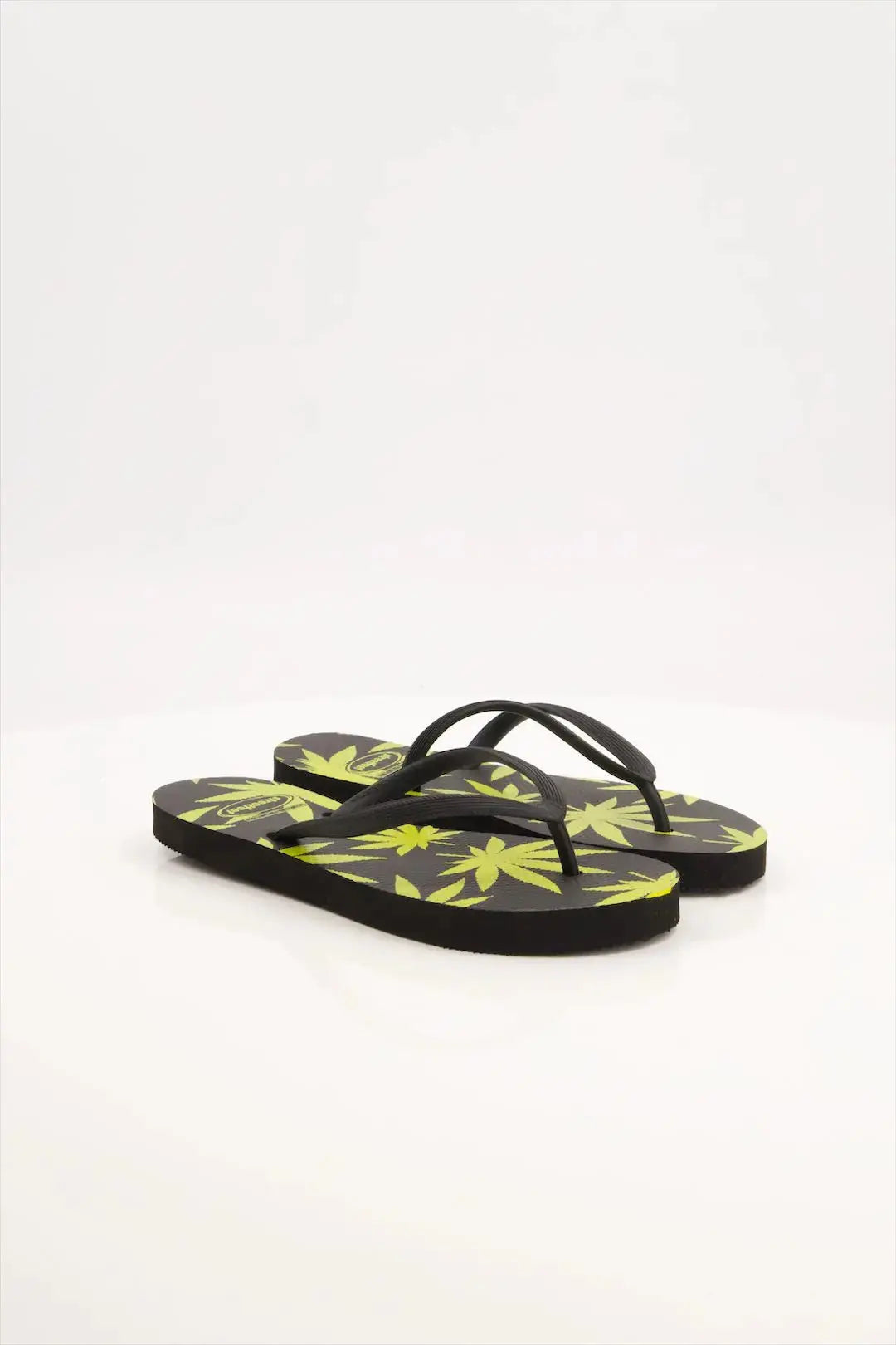 Leafy Pattern Flip-Flops with vibrant green leaf design, featuring soft cushioned soles and sturdy rubber straps.
Lightweight and breathable flip flops for casual everyday wear, perfect for summers.
Ideal ladies sandals for any occasion and activity. 
Available in 2 versatile color combinations-  yellow & black and green & off-white.
