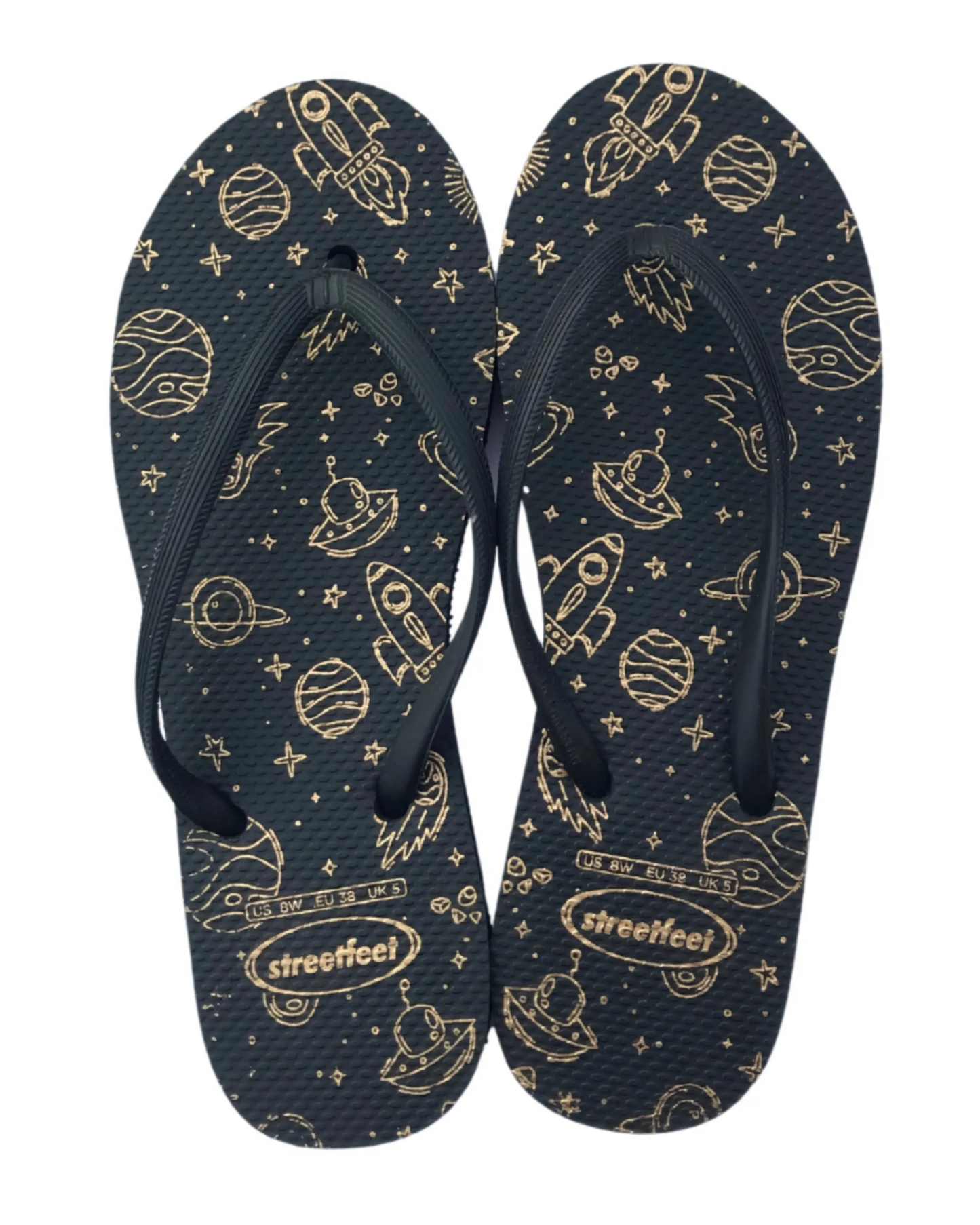 Ladies flip flops with celestial gold rocket and planet design on a dark background from Streetfeet

