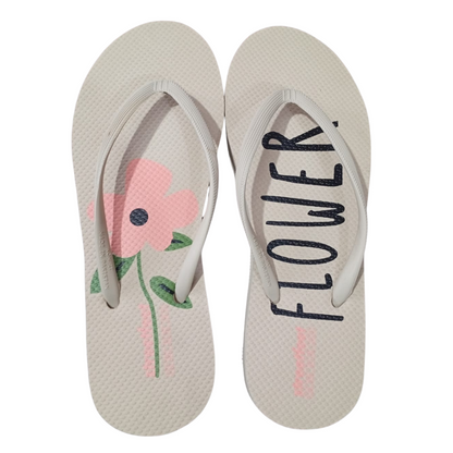 Streetfeet Flower – styled product image of floral flip flops
