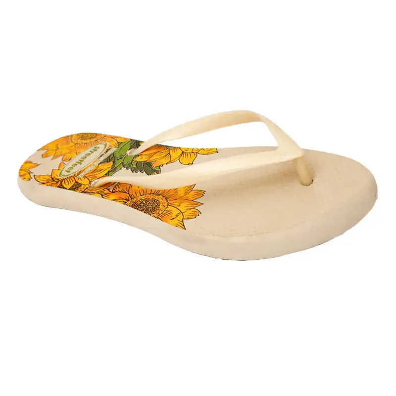 Bloom Flip-Flops featuring a yellow floral design, soft cushioned soles, and durable rubber straps for everyday comfort. Available in 4 variants- yellow, red, black and white.