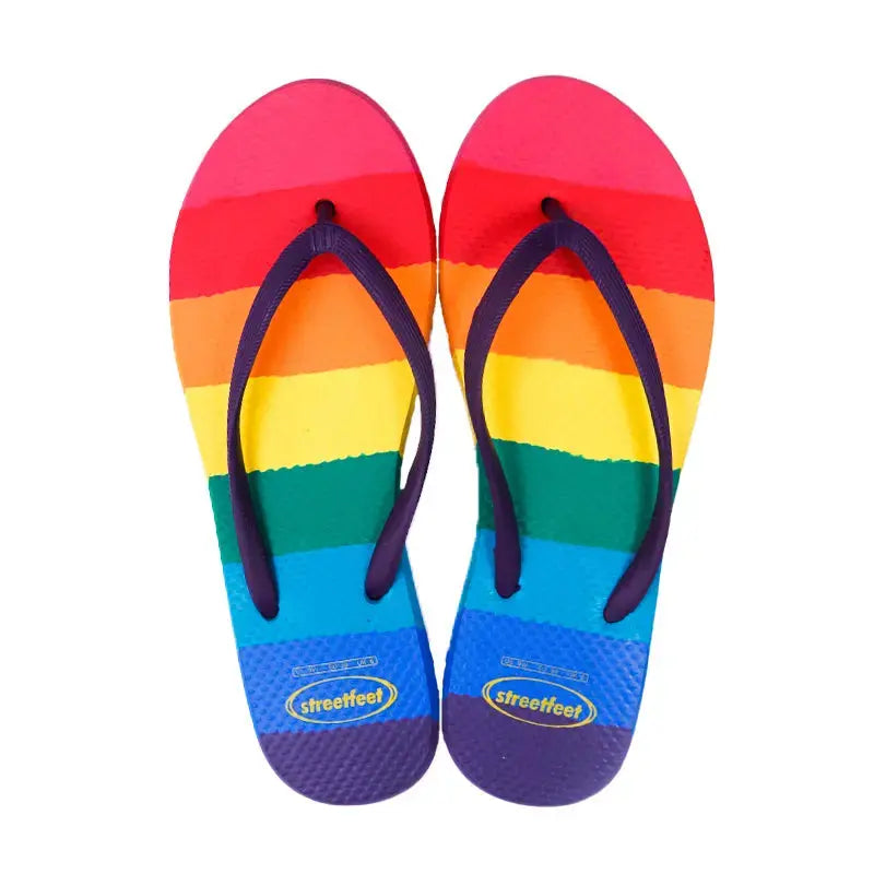 Rainbow Flip Flops by StreetFeet – Vibrant and comfortable footwear with colorful rainbow design, cloud-like footbed, and durable outsole, perfect for brightening up your day with every step.
