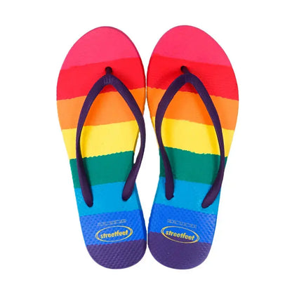 Rainbow Flip Flops by StreetFeet – Vibrant and comfortable footwear with colorful rainbow design, cloud-like footbed, and durable outsole, perfect for brightening up your day with every step.