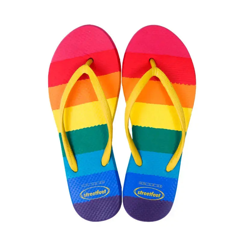 Rainbow Flip Flops by StreetFeet – Vibrant and comfortable footwear with colorful rainbow design, cloud-like footbed, and durable outsole, perfect for brightening up your day with every step.